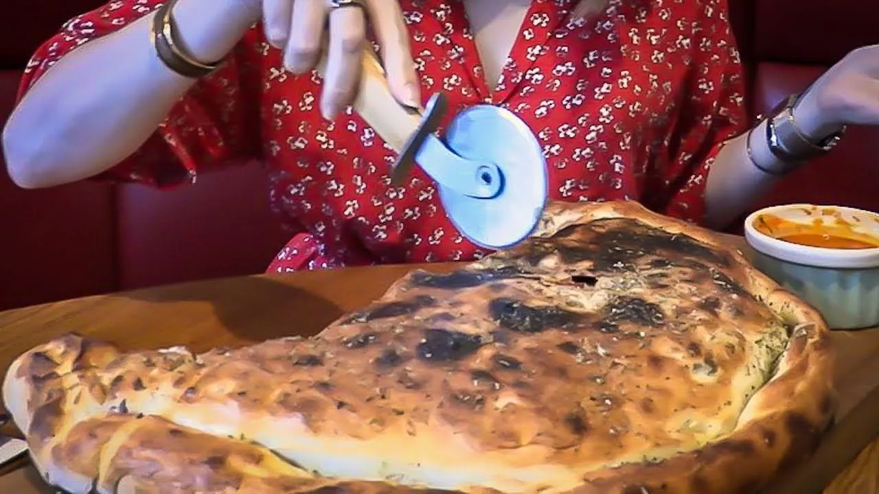 Thumbnail for the Giant Calzone Challenge at Amalia video