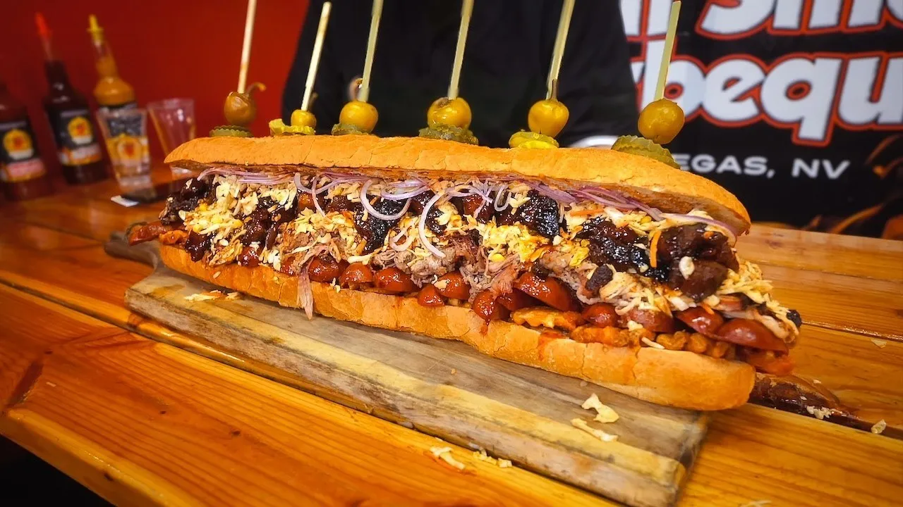 Thumbnail for the Triple Gutbuster Challenge at Rollin' Smoke BBQ video