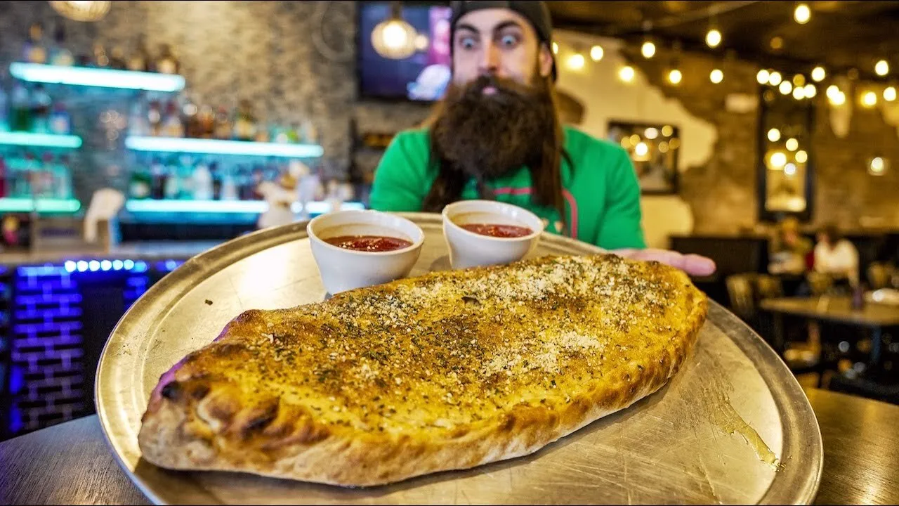 Thumbnail for the Monster Calzone Challenge at Cafe Panuzzo video